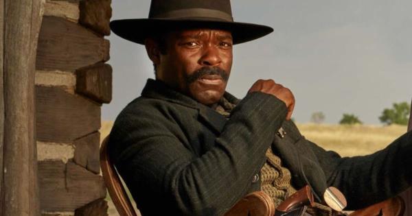 Bass Reeves facing forward and sitting in a chair