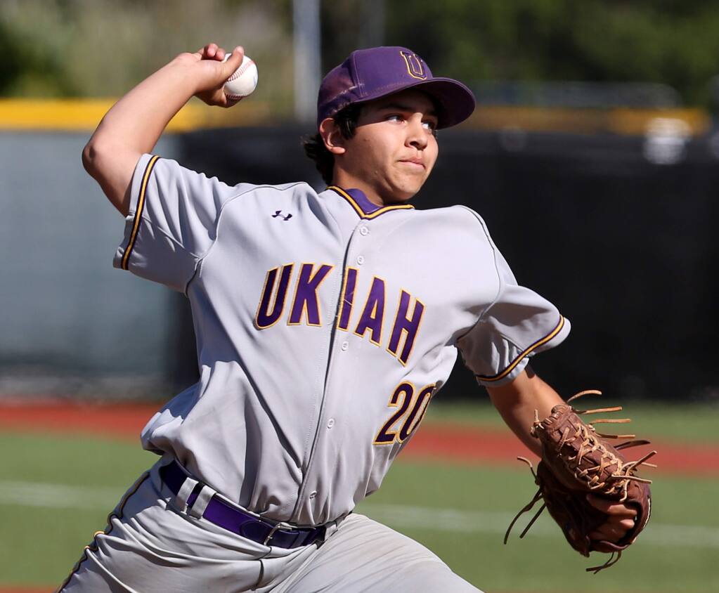 Ukiah's Devin Kirby pitched during the game held at Cardinal Newman High School, Friday, April 10, 2015. (CRISTA JEREMIASON / The Press Democrat)