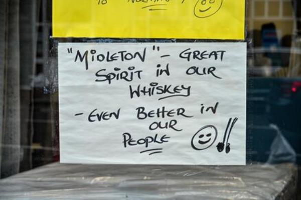 An upbeat sign in the window of O’Brien Interiors, Midleton, Co Cork. Despite the havoc wreaked by Storm Babet, local people say they are determined to get back to normal as quickly as possible. Picture: Chani Anderson