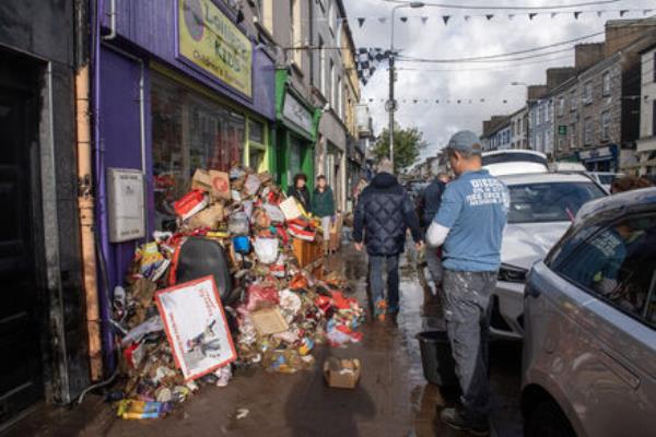  In a scene repeated all over the centre of Midleton, Co Cork, destroyed stock and furnishings were piled up outside Lollipop Kids on Main Street, Midleton, last week. Picture: Dan Linehan