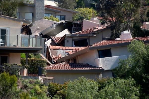 Damaged homes are torn apart by earth movement in the Los Angeles County city of Rolling Hills Estates.