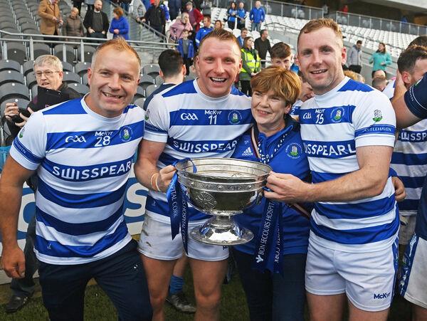  FAMILY FORTUNE: Castlehaven brothers Brian and Michael Hurley with their mother Patricia with the Andy Scannell trophy.